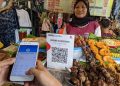 Pembayaran digital semakin menjadi bagian dari aktivitas ekonomi sehari-hari masyarakat Indonesia. QRIS kini menjangkau puluhan juta merchant, mayoritas merupakan pelaku UMKM.