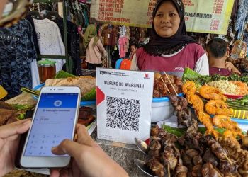 Pembayaran digital semakin menjadi bagian dari aktivitas ekonomi sehari-hari masyarakat Indonesia. QRIS kini menjangkau puluhan juta merchant, mayoritas merupakan pelaku UMKM.